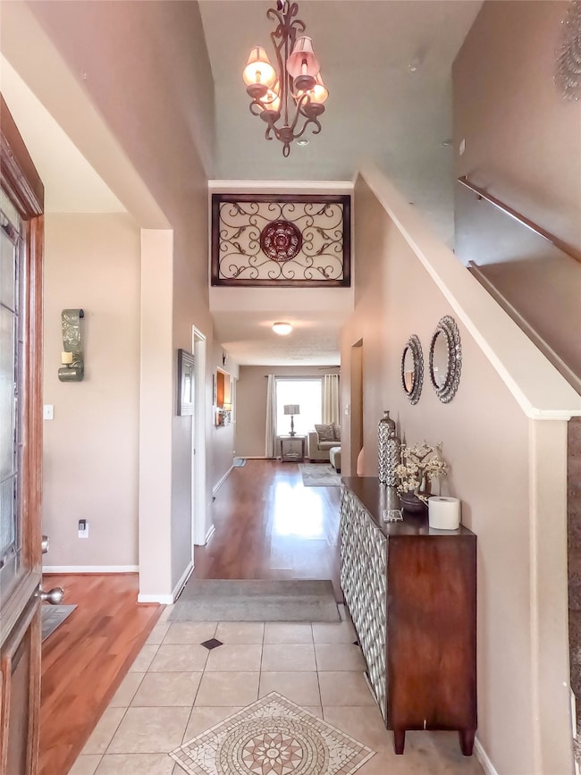Elegant entryway with stunning chandelier and spac