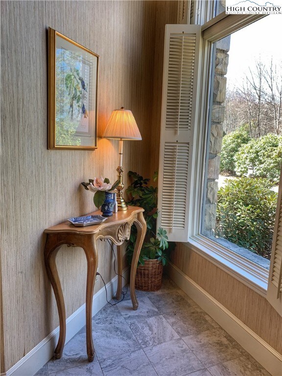 Large floor to ceiling windows greet you in foyer