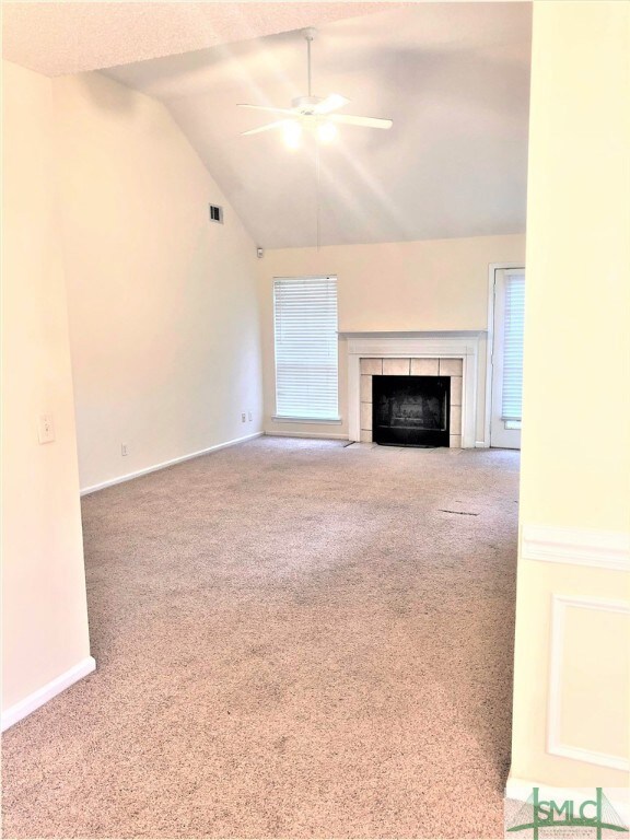 Spacious formal living room with vaulted ceiling a