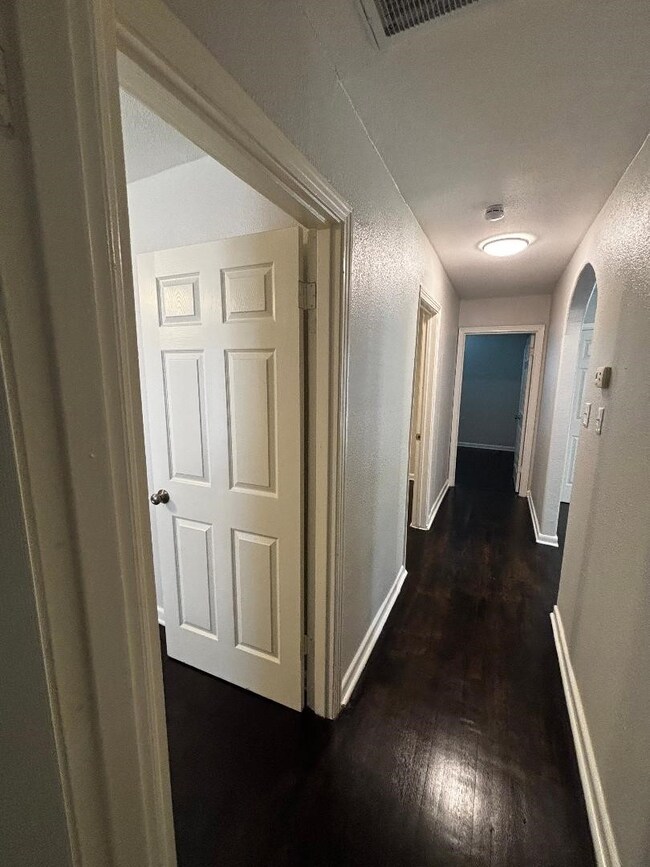 Hallway leading to the bedrooms and bathroom