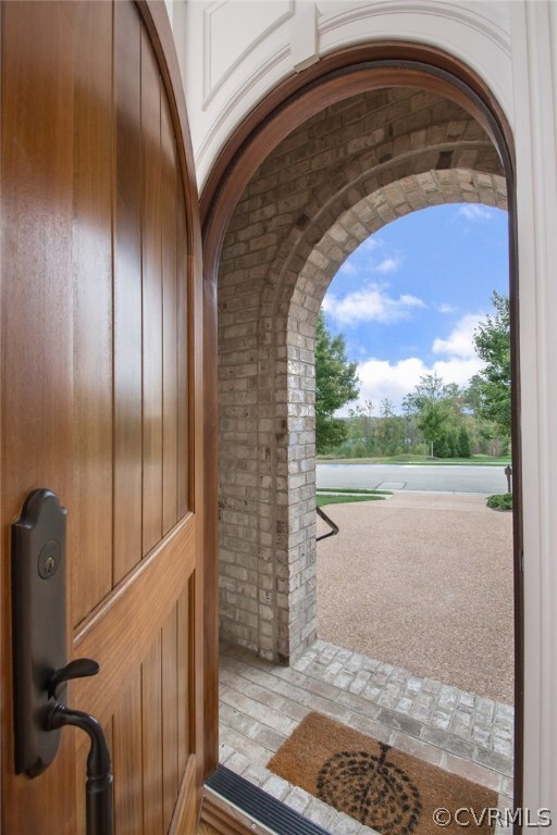 The arch of the covered vestibule is repeated in t