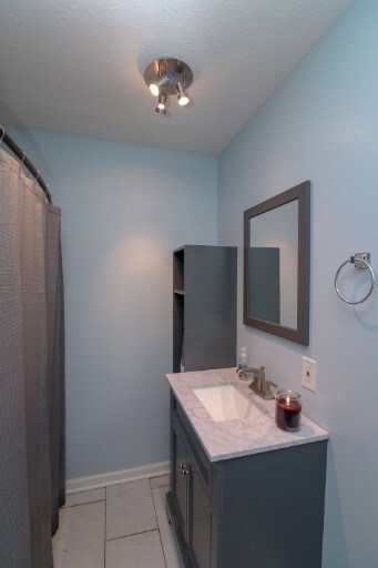 Hall bath with full tub and shower