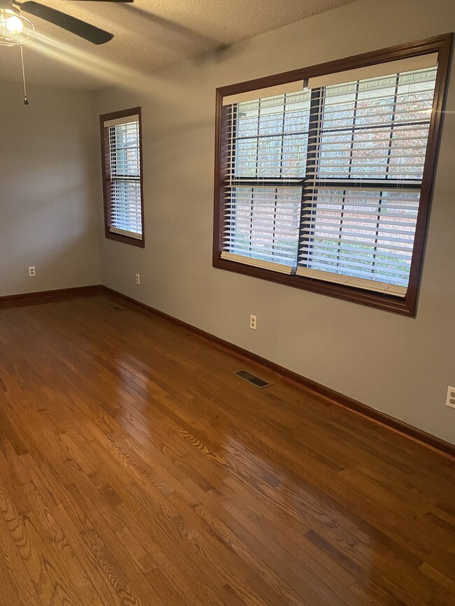 The large windows offer lots of light. The room is large enough for a formal dining area at the end.