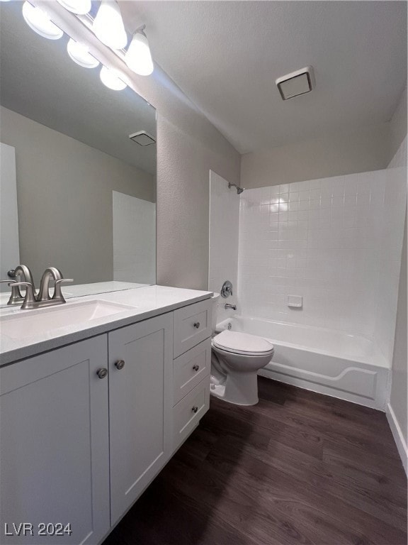 Full bath with wood finished floors, toilet, showe