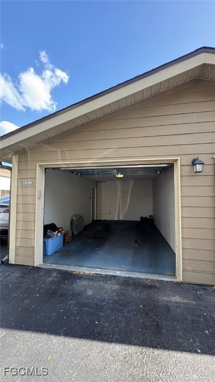 Garage featuring aphalt driveway
