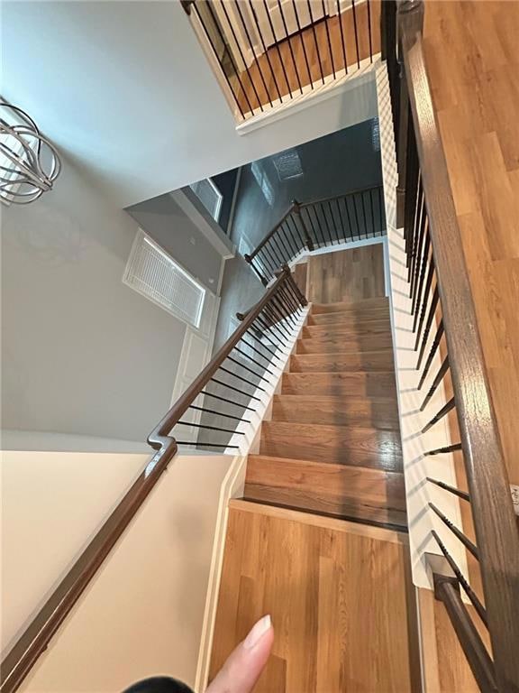 Staircase with wood finished floors