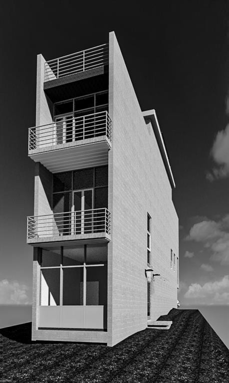 View of property exterior featuring a balcony