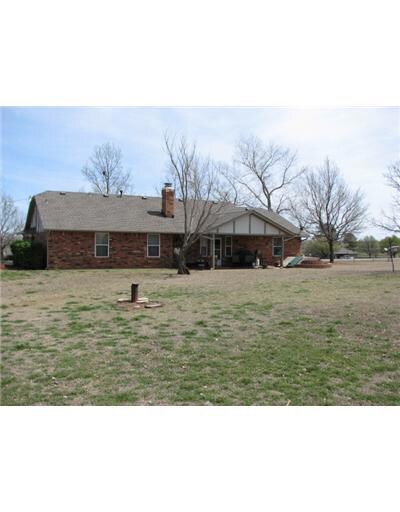 Exterior Back. Very large fenced in area but the l