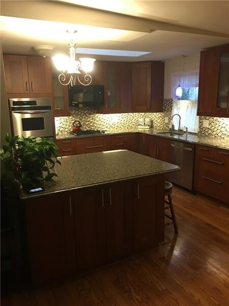 BEUATIFUL renovated kitchen open to living area. Q