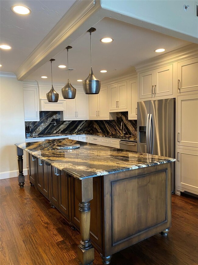 Chef-style kitchen, enhancing beautiful granite co