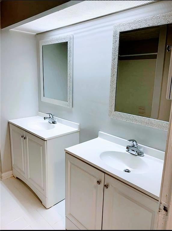 Bathroom featuring vanity and tile patterned floors