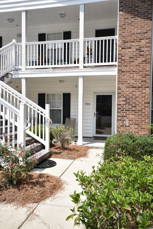Doorway to property featuring a balcony