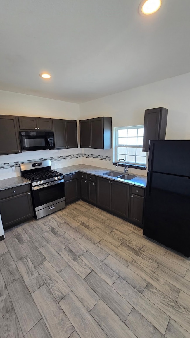 Spacious kitchen featuring ample cabinet storage,
