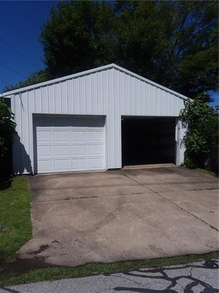 Two car detached garage is accessible from alley.