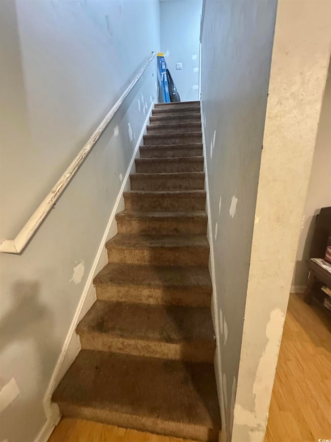 Staircase with wood finished floors
