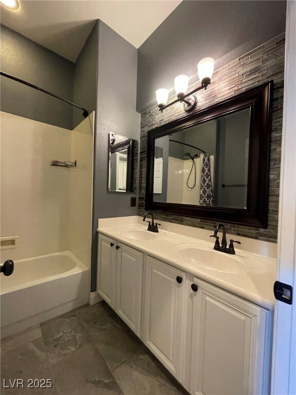 Bathroom featuring shower / bathtub combination wi