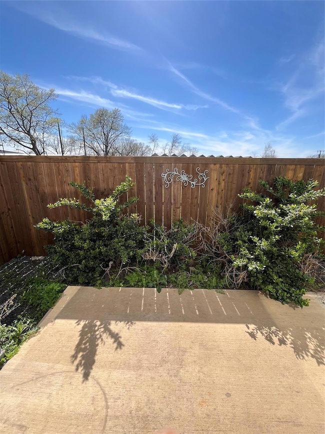 View of yard featuring a patio and a fenced backya