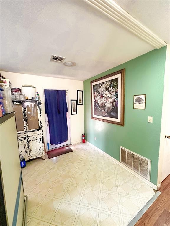 Empty room featuring baseboards