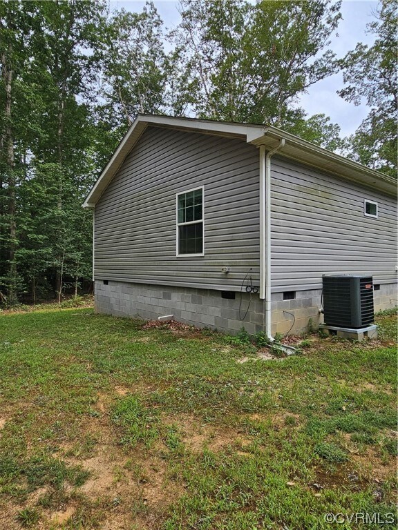 View of property exterior featuring central AC and