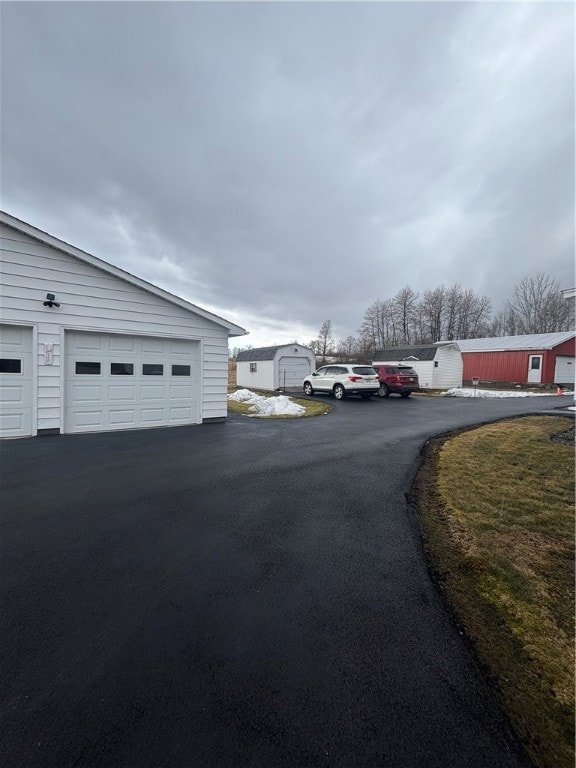 Blacktopped, circular driveway