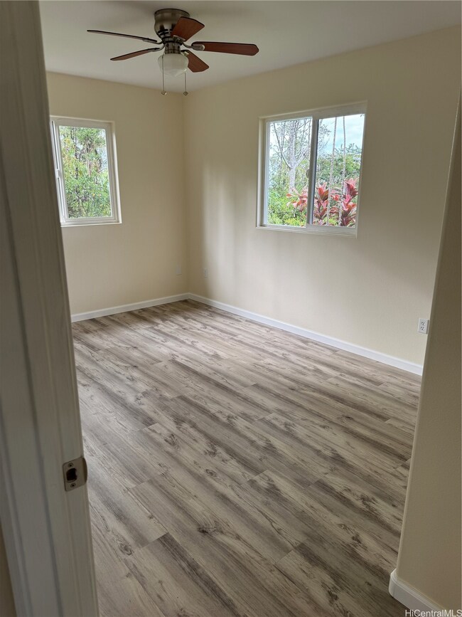 Back bedroom, notice every room has ceiling fans f