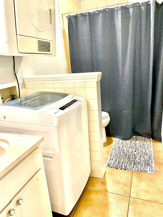 Bathroom with washer and dryer