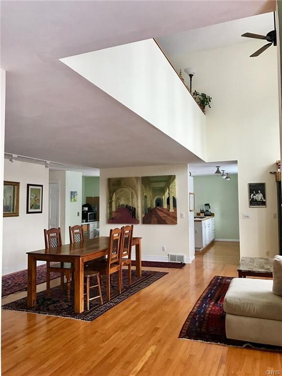 DINING AREA WITH 2ND FLOOR LOFT ABOVE