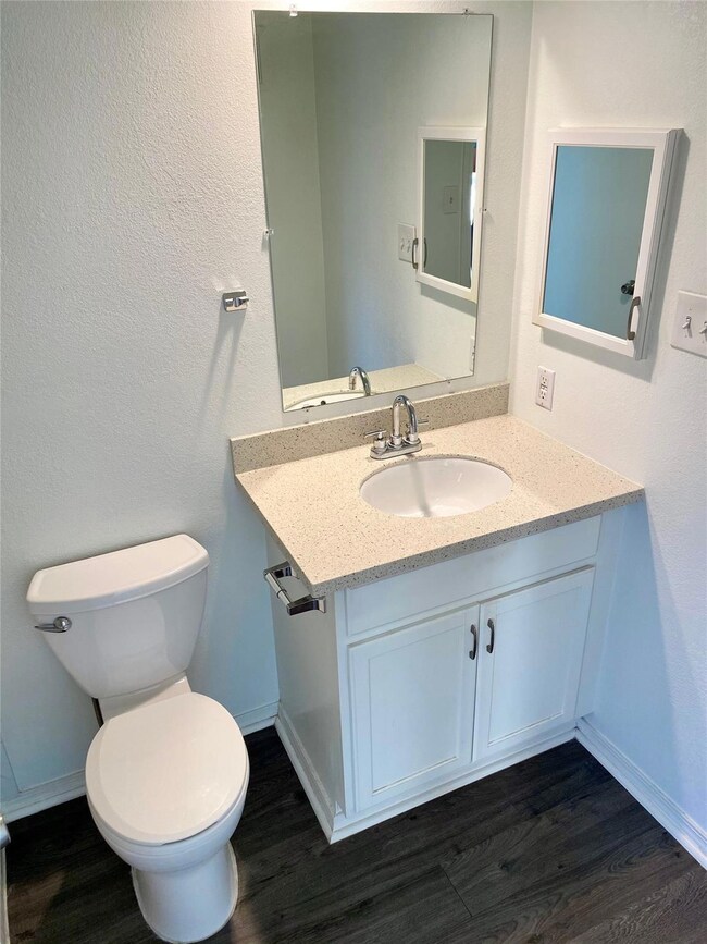 Renovated bathroom with medicine storage cabinet.