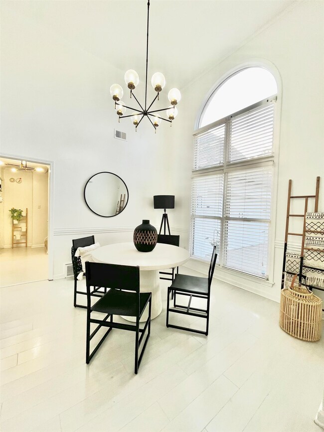 Dining room with light wood-type flooring and a ch