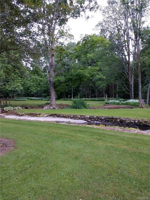 This brook runs through the yard to a pool