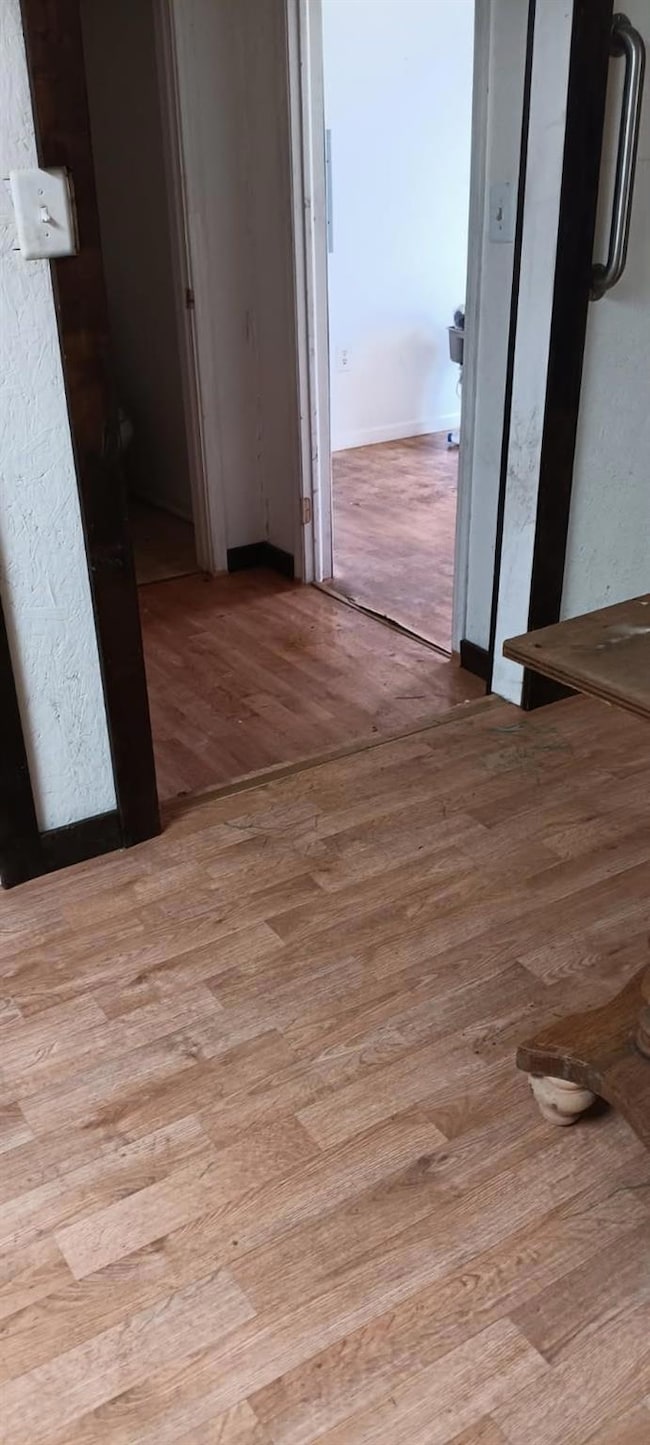 Hallway featuring wood finished floors
