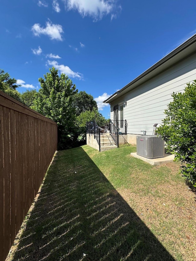 View of yard with central AC unit