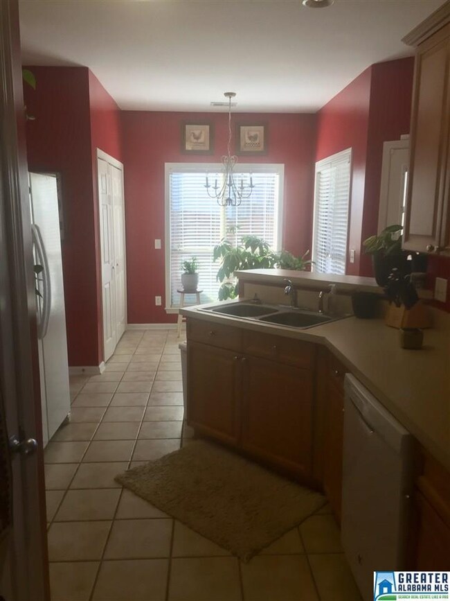 Kitchen with built in appliances and breakfast bar