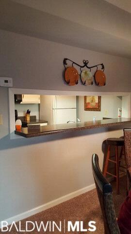 Looking toward the kitchen with pass through