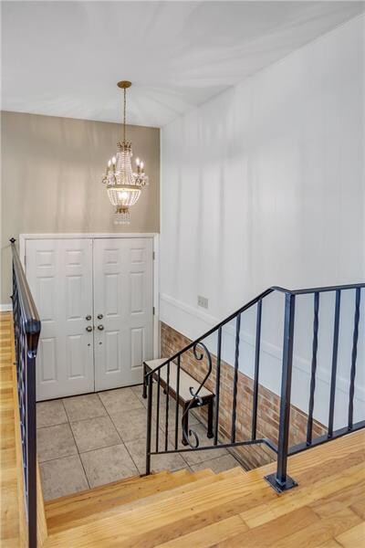 Beautiful Swarovski crystal chandelier in entry.