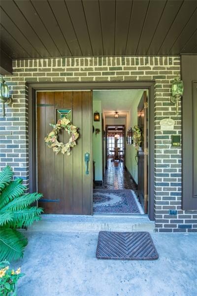 The Double Entry Doors open into the Wide Foyer