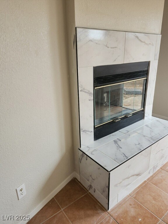 Detailed view of a high end fireplace, baseboards,