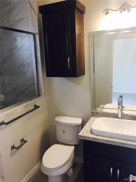 Bathroom with vanity and toilet