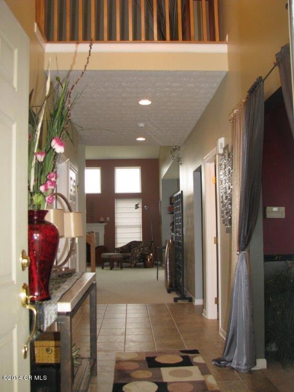 Two story entry has open loft above