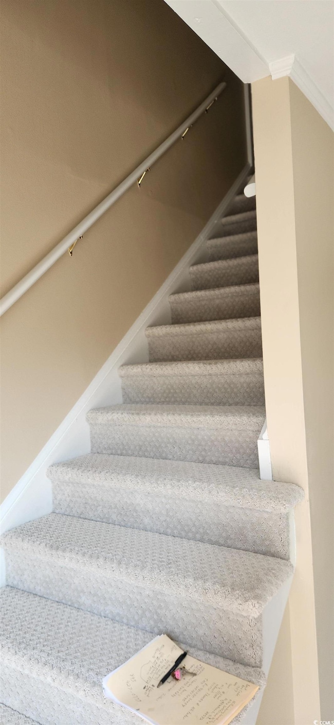 Stairs featuring ornamental molding