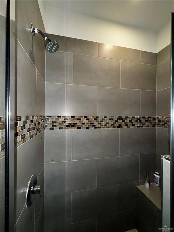 Bathroom with a tile shower
