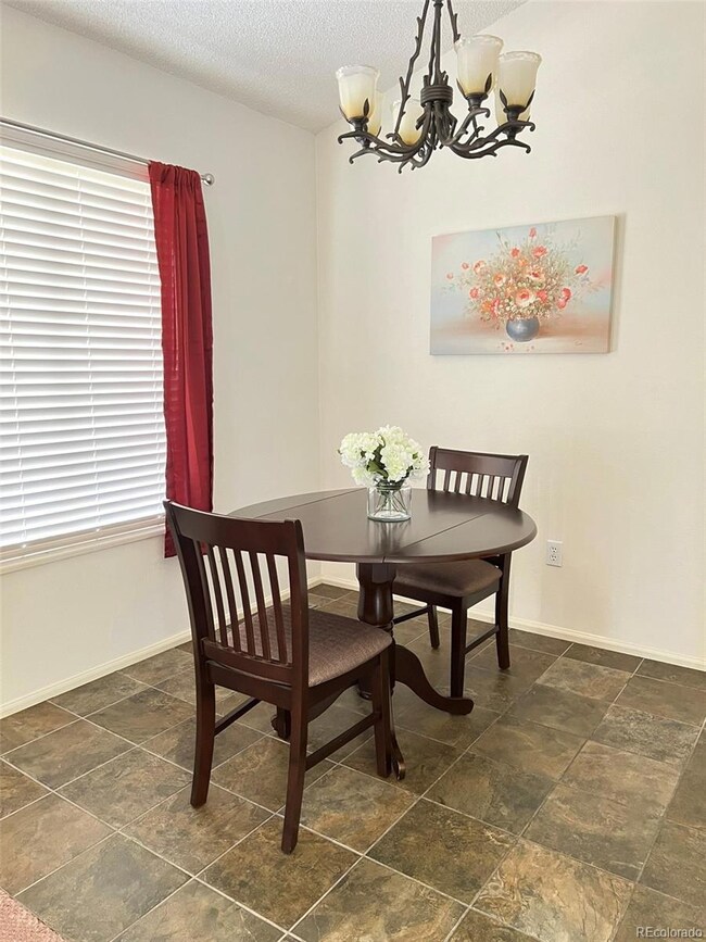 Dining room with ceramic slate tile