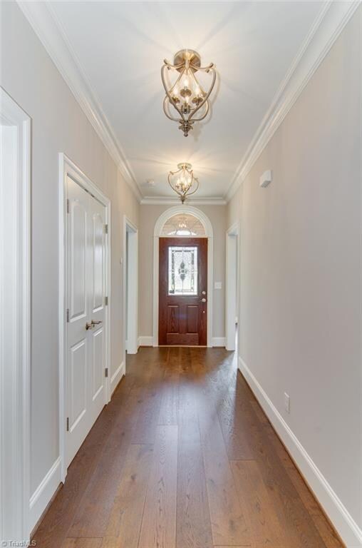 Entry hallway leads to Dining/Kitchen area, Family room and Guest bedrooms. Bright and beautiful wood floors