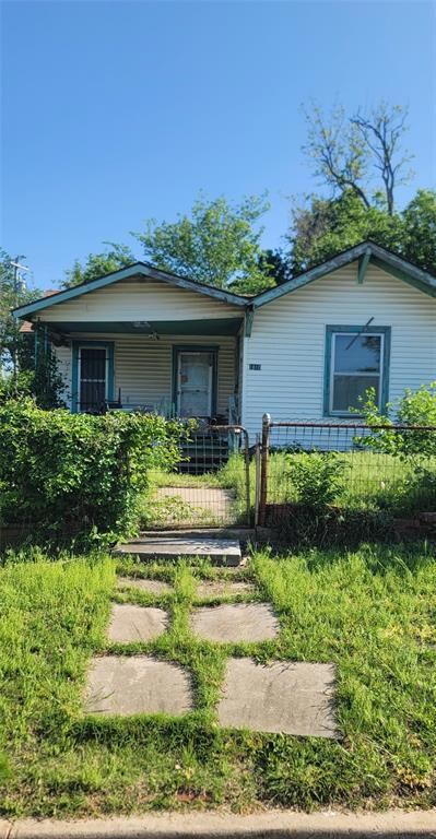 View of front of property with a fenced front yard