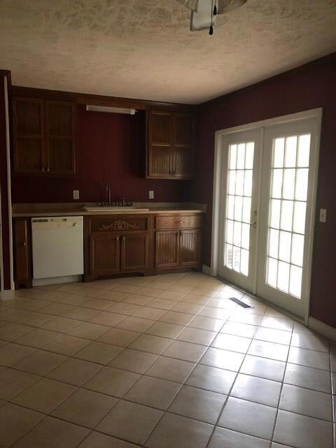 Kitchen with french doors to screened porch