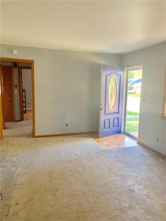 Great Room w/ newer carpet and hardwoods under
