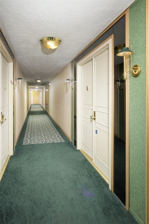 First door on the right after exitiing the elevato