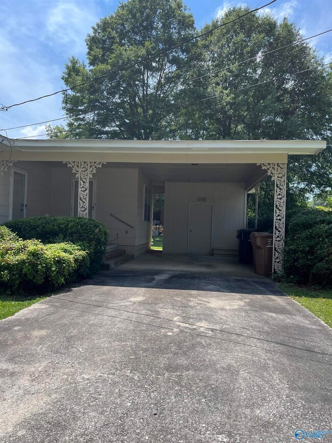 One car carport on rear of home.  Also, has storage room
