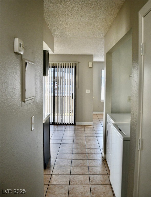 Laundry room featuring washing machine and dryer,