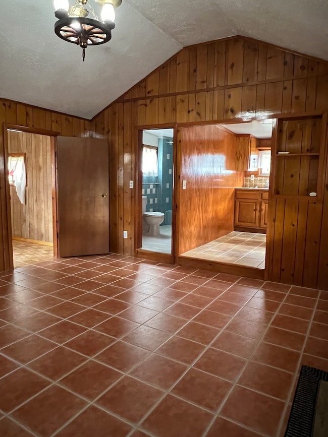 Living room connects to kitchen, bath, and bonus room.